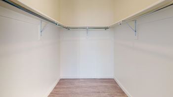 A room with white walls and wooden flooring.